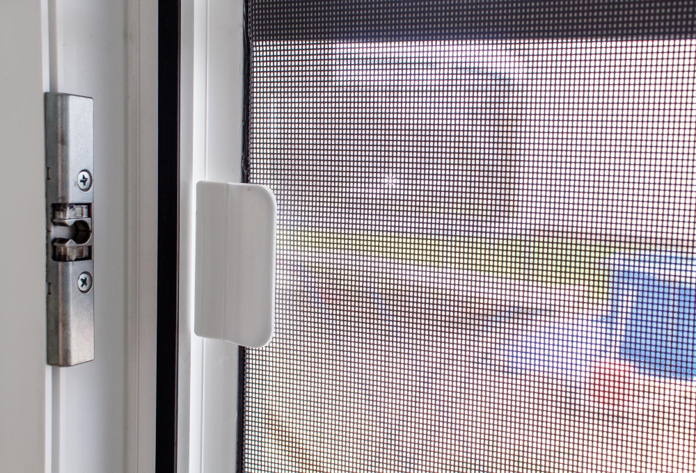 Modern aluminum screen door on a coastal home