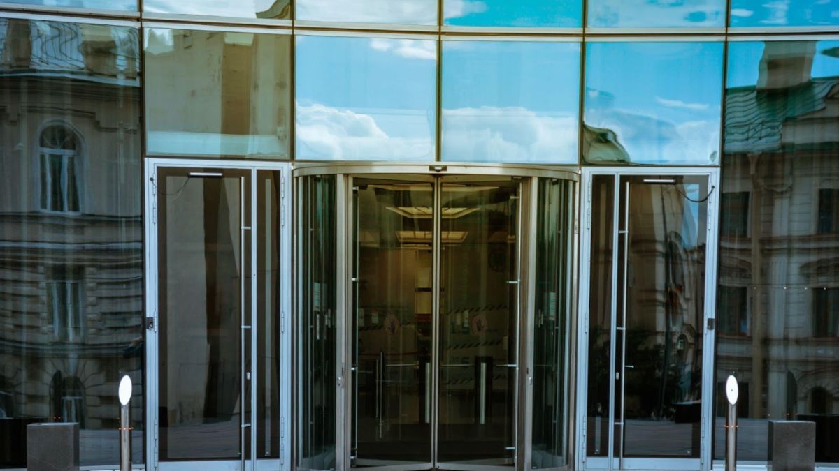 A glass door featuring a prominent "open" sign, inviting customers to enter the establishment.