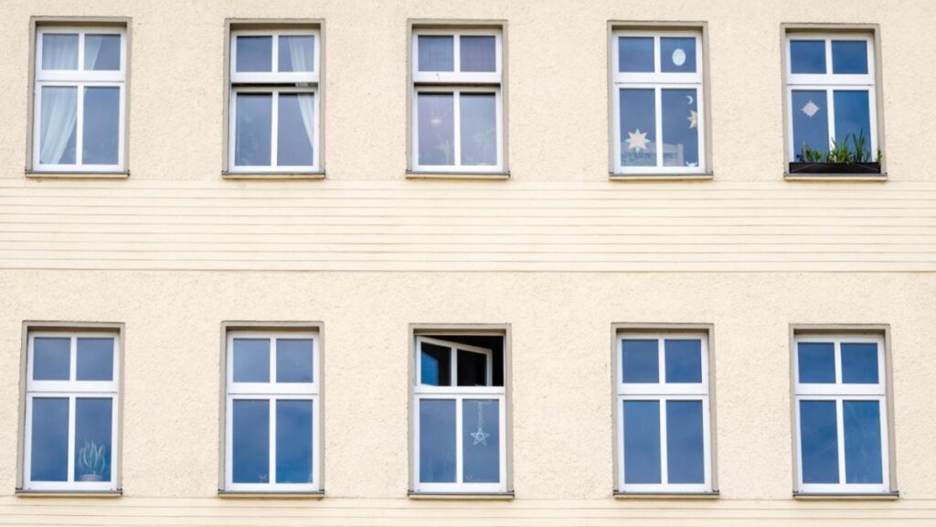 The exterior of a building showcasing various windows.