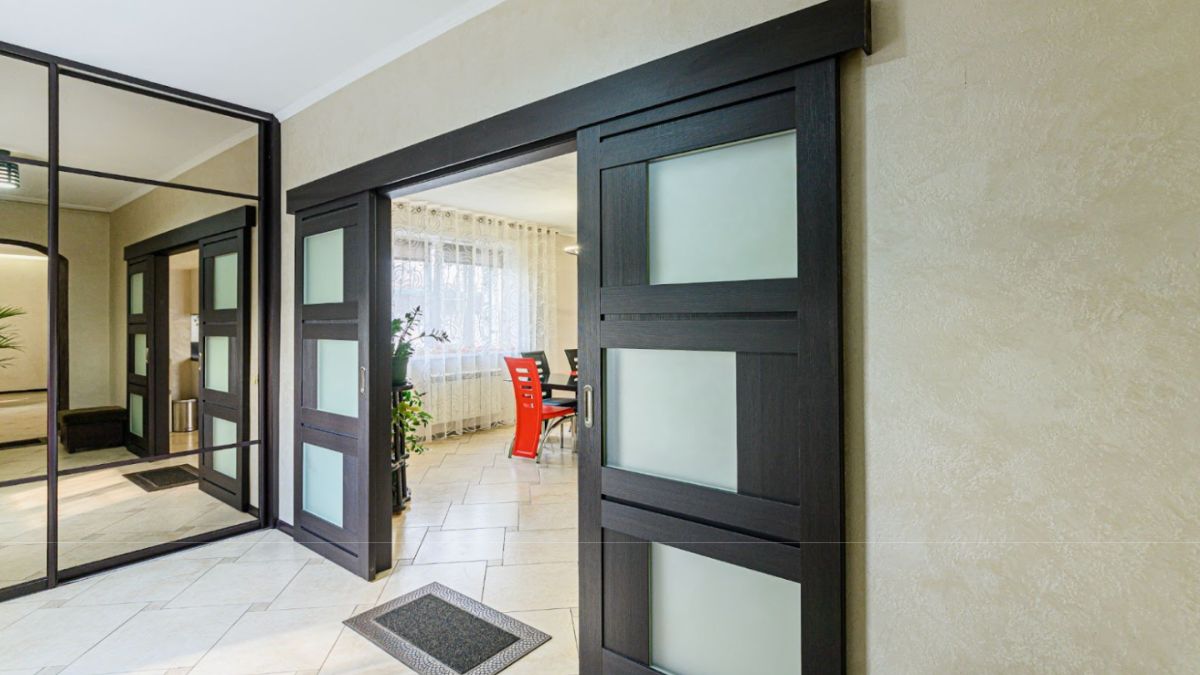 A custom black sliding door that gives the house a unique style.