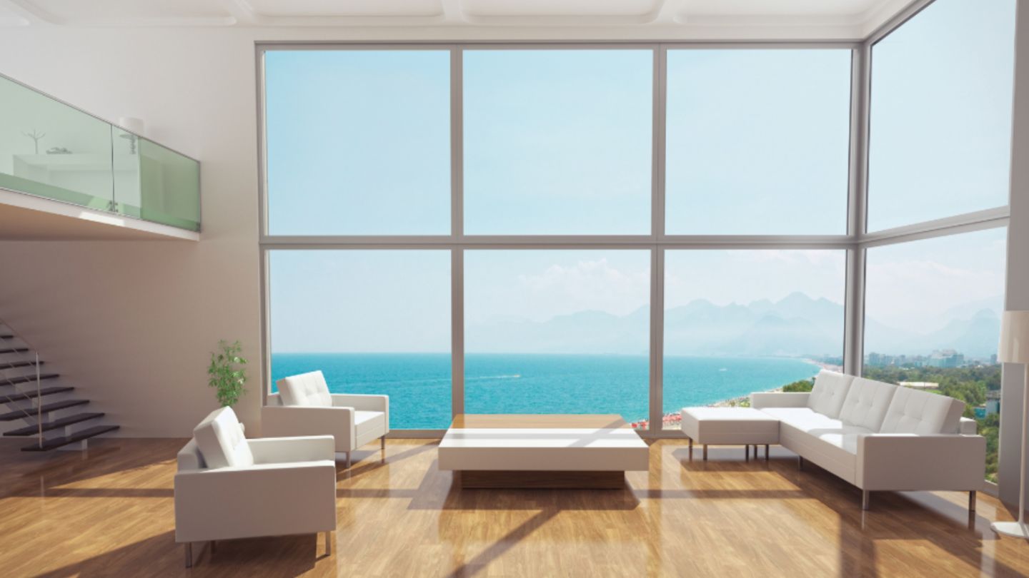 Bright living room with Low-E windows showcasing an oceanfront view.
