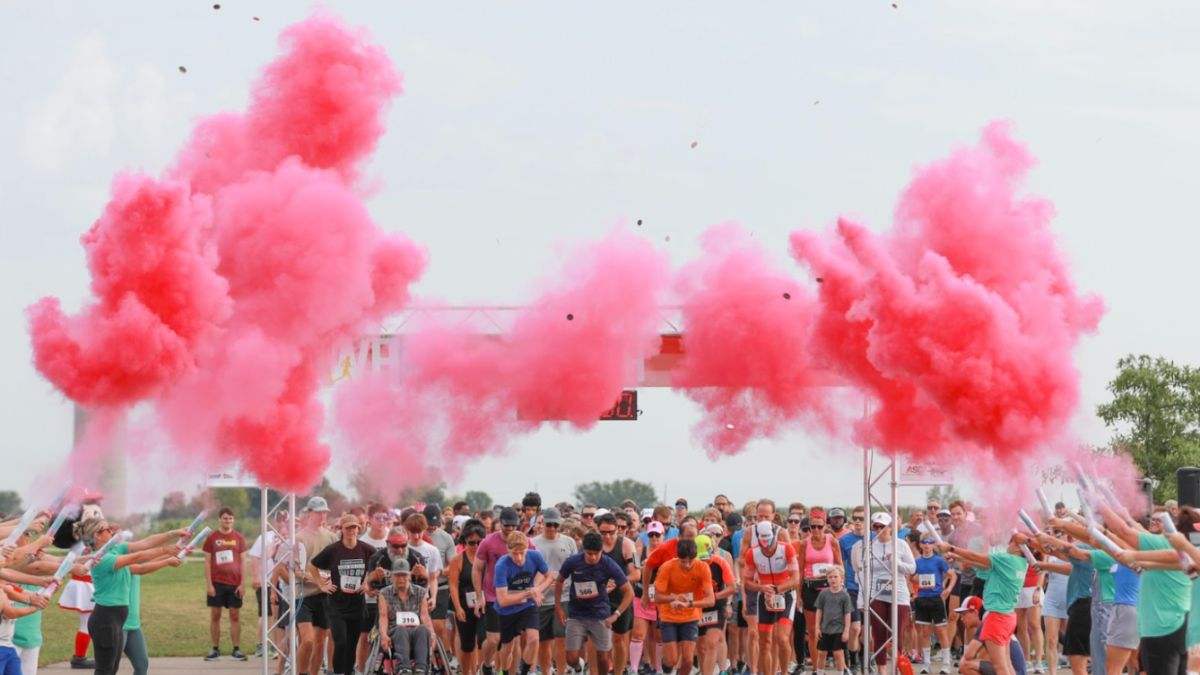 Families and supporters participating in a Karen Wellington Foundation fun run to raise breast cancer awareness.